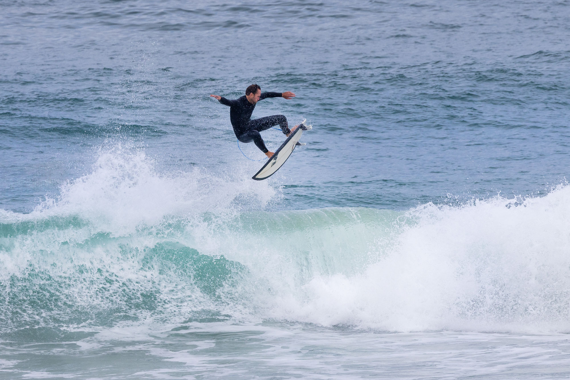 Surfers sharing waves in a Moroccan lineup — etiquette and respect in the water